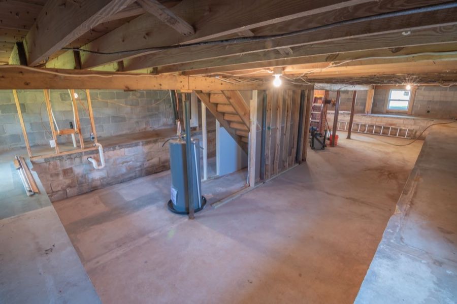 Sump pump and battery backup in a basement pit